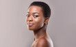 © Prostock-studio - Natural beauty. Closeup portrait of beautiful black girl with natural makeup and short hair, grey studio background with copy space