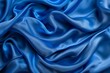 © Larysa - Photo of Blue silk fabric drapery material. Background texture for backdrops or mapping