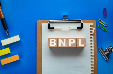 There is wood cube with the word BNPL. It is an abbreviation for Buy Now, Pay Later as eye-catching image.