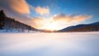 A serene winter landscape at sunset, showcasing snow-covered fields.