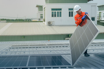 engineer man inspects construction of solar cell panel or photovoltaic cell by electronic device. Industrial Renewable energy of green power. factory worker working on tower roof.