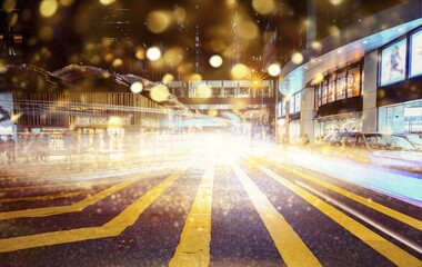 Wall Mural - A busy street in Hong Kong at night with blurred lights and a yellow crosswalk in the foreground.