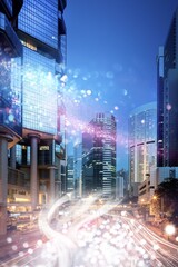 Wall Mural - Cityscape at night with illuminated skyscrapers and blurred street lights.