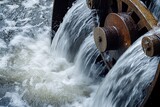 Water cascading over a rusty water wheel