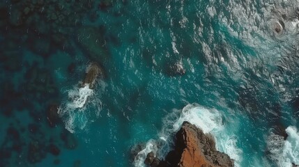 Poster - Aerial View of Turquoise Ocean Waves and Rocky Shoreline