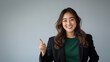 © Creative Art7 - A young Japanese businesswoman is smiling and pointing to the side with her right hand