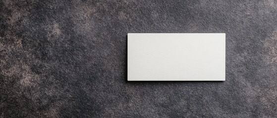 Close up of a Blank Business Card Mockup on a Dark Textured Surface