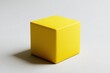© kristina - Yellow cube on white surface, casting long shadow under bright sunlight.