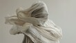 © Napat.T - A woman is wearing a white scarf and is blowing it in the wind