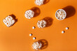 © Julia - Organic dietary supplements, many capsules of vitamins and minerals in small bowls from above on an orange background. Nutritional supplements, pills and tablets, top view. Healthy lifestyle.