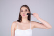 © Volodymyr - Beauty girl with makeup brushes. Make up for woman. Girl with makeup brushes near face. Cosmetic brush. Facial Makeup. Female model applying blush powder foundation tone.