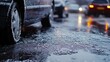 © sirisakboakaew - Sleet covering cars and roads in a thin layer of ice, causing slippery conditions as freezing rain continues to fall