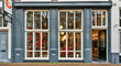 © Alexander Bugayov - Charming boutique shop with gray and white facade in urban setting
