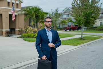 Businessman walk near house in american neighborhood. Business man walk down street, late for a meeting. Business man in suit walking be success. Walking business man.