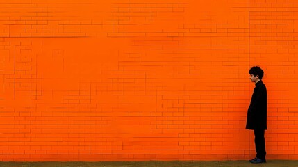 silhouette of a person on red brick wall