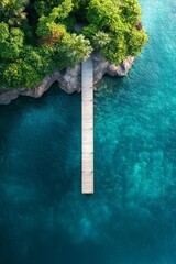 Wall Mural - Aerial view of a wooden dock extending into vibrant turquoise waters surrounded by lush greenery in a tropical setting