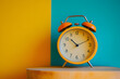 © Ram - Alarm clock on a vibrant yellow and teal background, evoking nostalgia and timeless style. Ideal for concepts of time management, routine, and classic decor inspiration