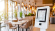 © Studios - Modern design white glossy self-service kiosk as the focal point in a restaurant, vibrant lighting, digital menu display on the kiosk, clean and minimalist background