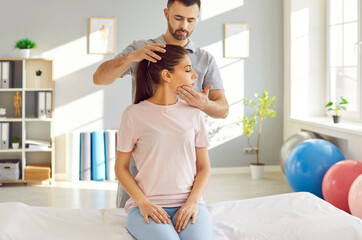 Rehabilitation, head, neck therapy by professional doctor, trainer nurse, manual therapy chiropractor helping female patient, physical therapist doctor massage to cure injury trauma, traumatologist