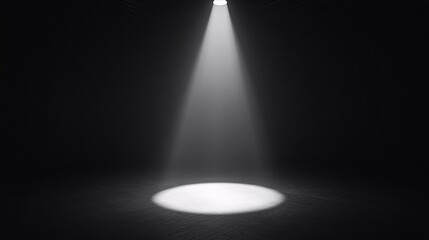 A dramatic beam of light shining down on an empty space, creating a spotlight effect against a dark background.