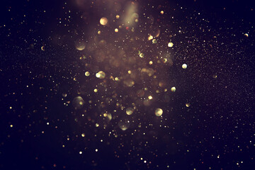 Wall Mural - blackground of abstract glitter lights. blue, gold and black. de focused