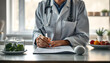 © Sergey - Nutritionist doctor writing diet plan on table isolated with white highlights, png