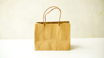 Blank cardboard paper shopping bags. Brown folding paper bags with handles. Recycled cardboard packaging for supermarket