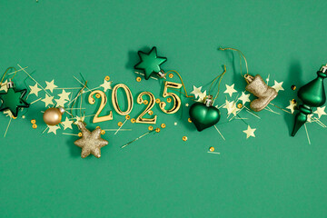 Wall Mural - New Year 2025 background, greeting card with golden numbers 2025 and Christmas decorations on green background. New Year's Eve, banner, flat lay