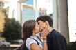 © olly - portrait of young couple embraced and kissing