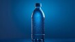 © Galib - A plastic bottle of water with condensation droplets stands against a vibrant blue backdrop.