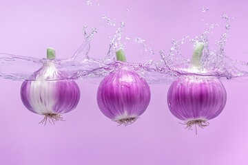 Wall Mural - Fresh purple onion falling in transparent water