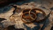 © Vii - Two gold wedding rings sit atop a newspaper, symbolizing love and commitment