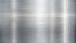 © Arties - Brushed stainless steel surface with horizontal linear texture.