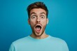© James - Portrait of young happy positive excited crazy shocked amazed man see big sale isolated on blue color background, Generative AI
