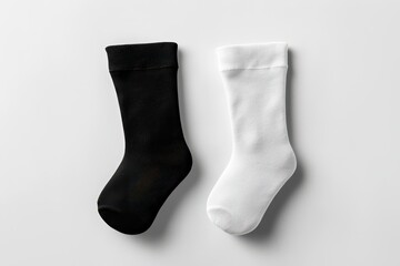 A minimalistic mockup showcasing one black and one white short sock isolated against white background. Ideal for product branding, fashion displays, or ecommerce use.