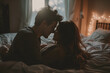 © PHAISITSAWAN - Romantic dim light bed scene, husband and wife kissing passionately.