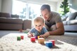 © Alexandra - Young stay at home father is bonding with his baby while playing with colorful wooden blocks on the floor of their living room