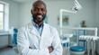 © Melissa - Portrait of black male dentist. He's standing in his dentist office.