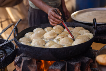 Indian food, Aloo puri being cooked in oil for lunch or dinner. Selective focus.