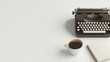 © pattaphorn - Vintage Typewriter and Coffee on Minimalist Desk