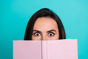 Wall Mural - Photo of cheerful pretty lady enjoy interesting scary book empty space isolated blue color background