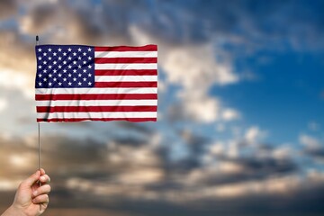 Waving Flag of United Stated of America on nature background