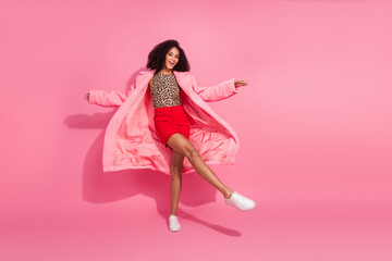 Poster - Full body photo of attractive young woman dancing have fun dressed stylish leopard print warm coat clothes isolated on pink background