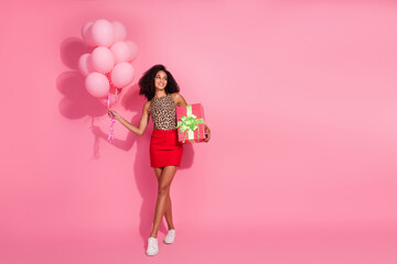 Wall Mural - Full body photo of young woman air balloons gift look empty space dressed stylish leopard print clothes isolated on pink color background