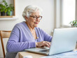 © uventa - senior woman surfing Internet on laptop