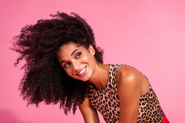 Poster - Photo of lovely young lady fluttering hair volume look empty space dressed stylish leopard print garment isolated on pink color background