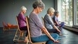 © irissca - Seniors enjoying a chair yoga class at a local community center, practicing seated poses under natural light