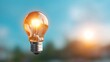 © maesarin - Glowing light bulb symbolizing a bright innovative idea for driving business growth achievement and future success  Concept of entrepreneurship opportunity