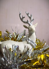 christmas arctic reindeer decor ornament in gold metalic background and glitters