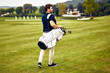 © Valerii Apetroaiei - A Golfer is Walking on the Golf Course with His Clubs as He Enjoys the Beautiful Day